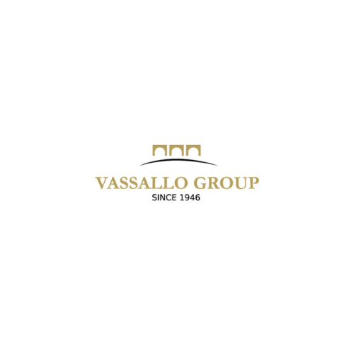 Vassallo Group logo with golden arch symbol and text ‘Vassallo Group Since 1946’